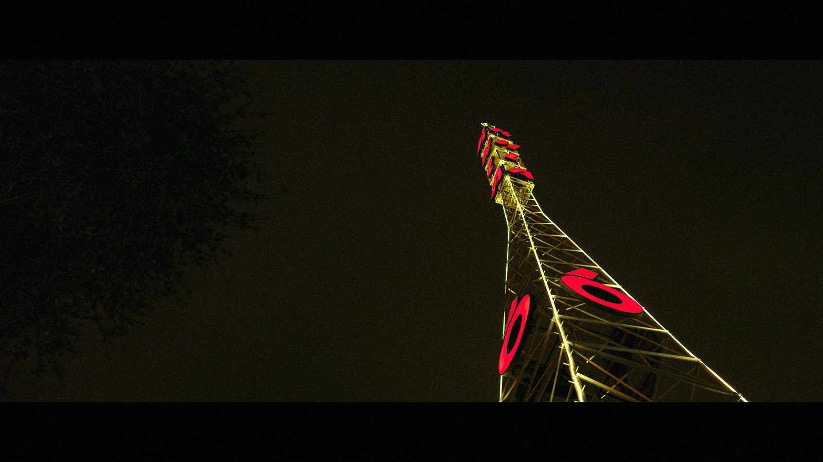 a very tall tower lit up at night