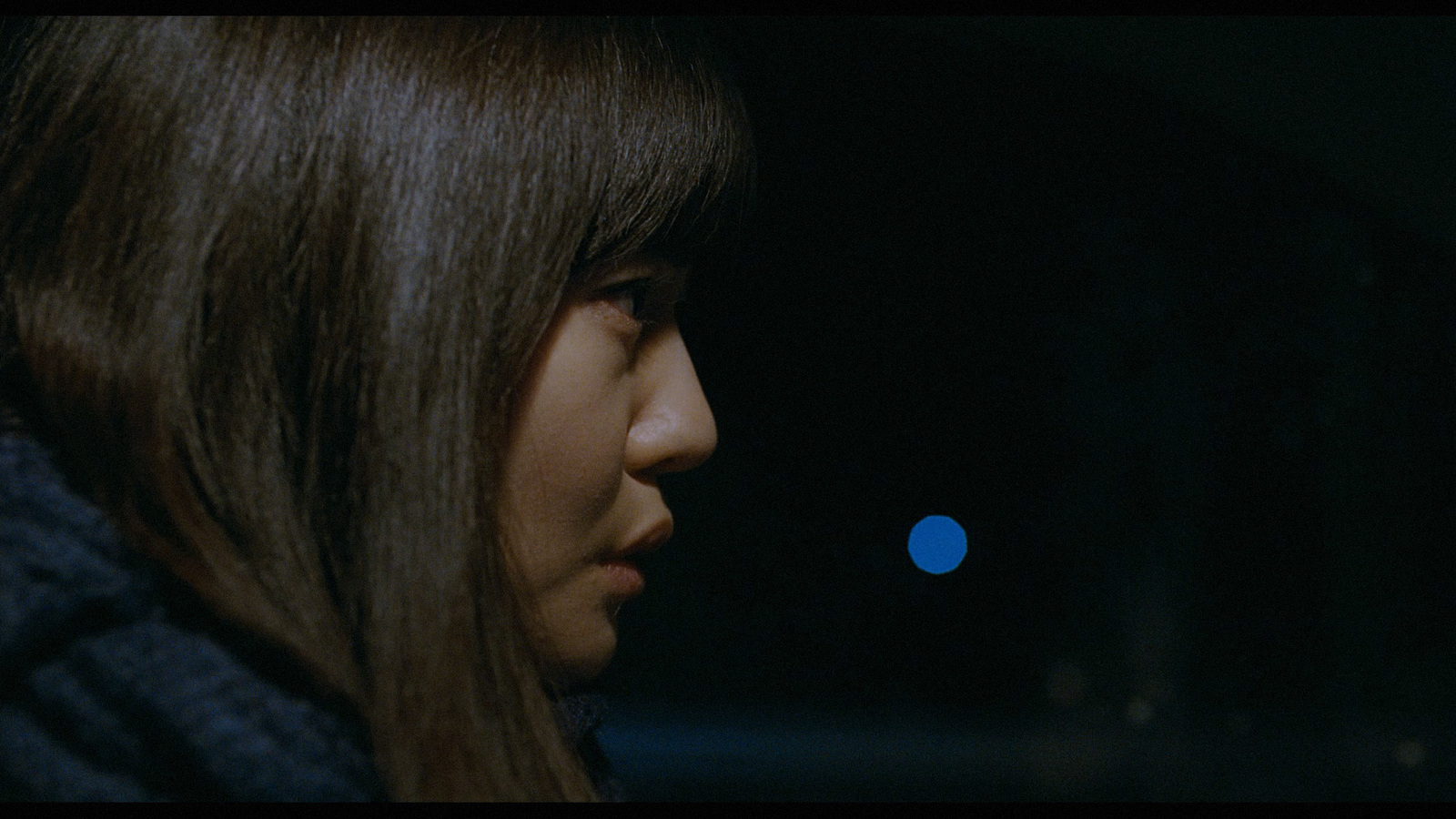 a close up of a person with long hair