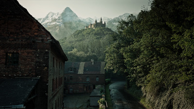 a view of a village with a mountain in the background