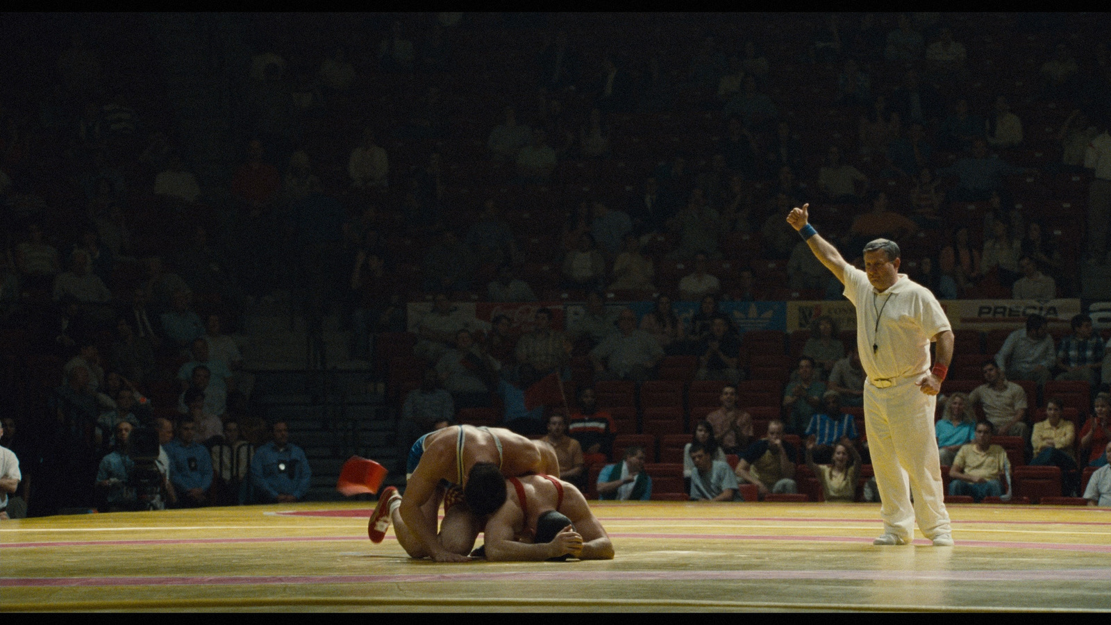 a man standing on top of a wrestling ring