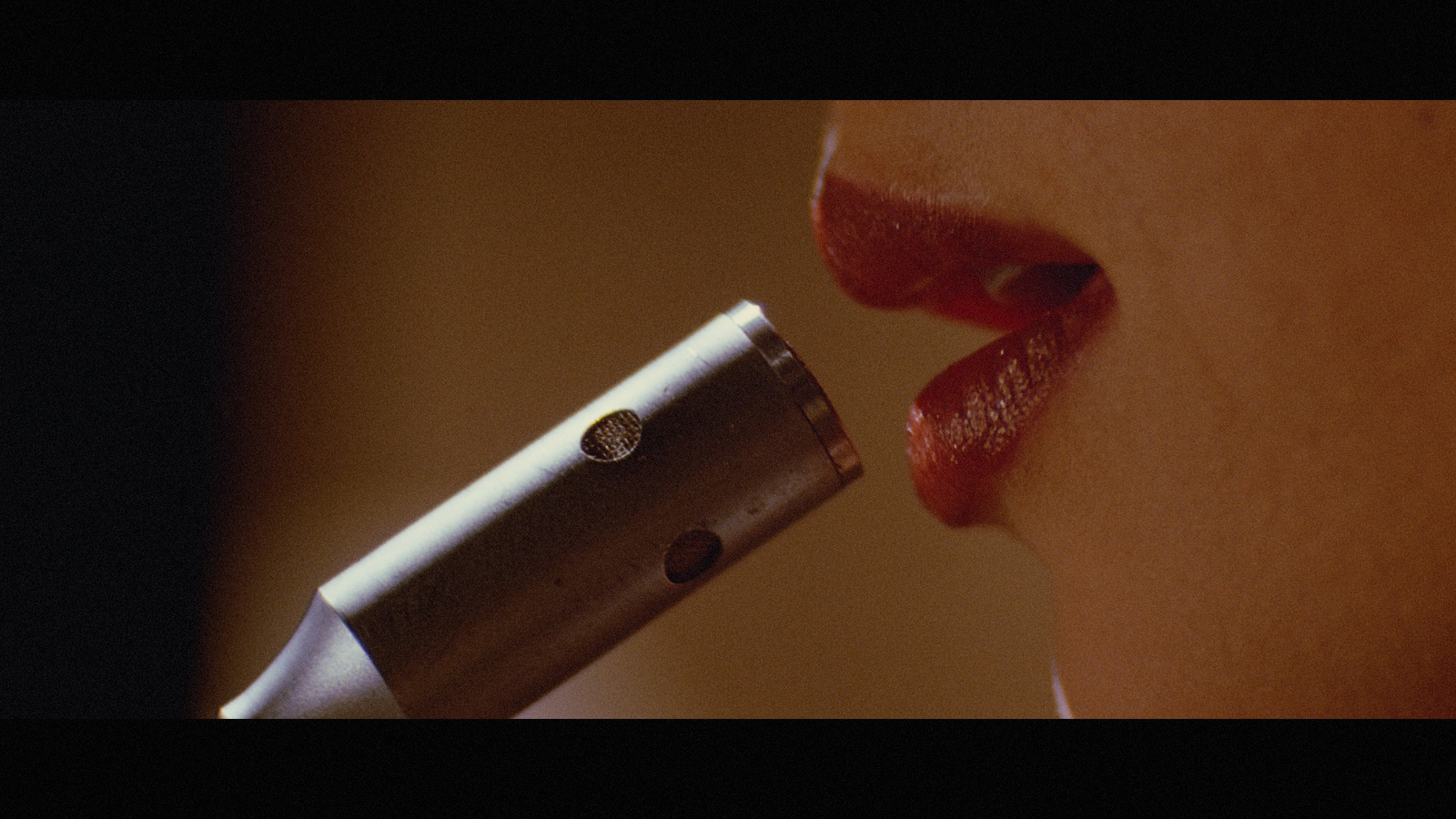 a close up of a person brushing their teeth