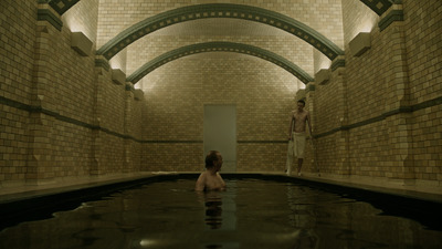 a man and a woman are standing in a pool of water