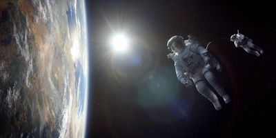 an astronaut floating in space next to the earth