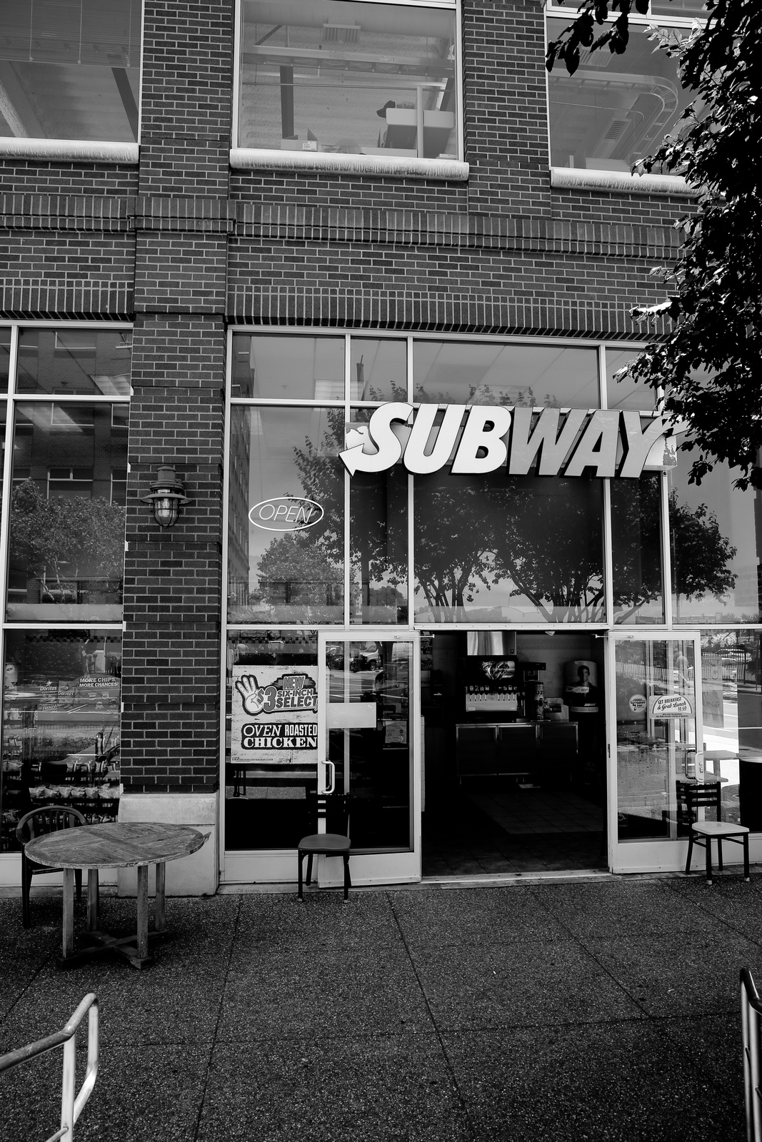 a black and white photo of a subway store