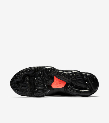 a pair of black and red shoes on a white background