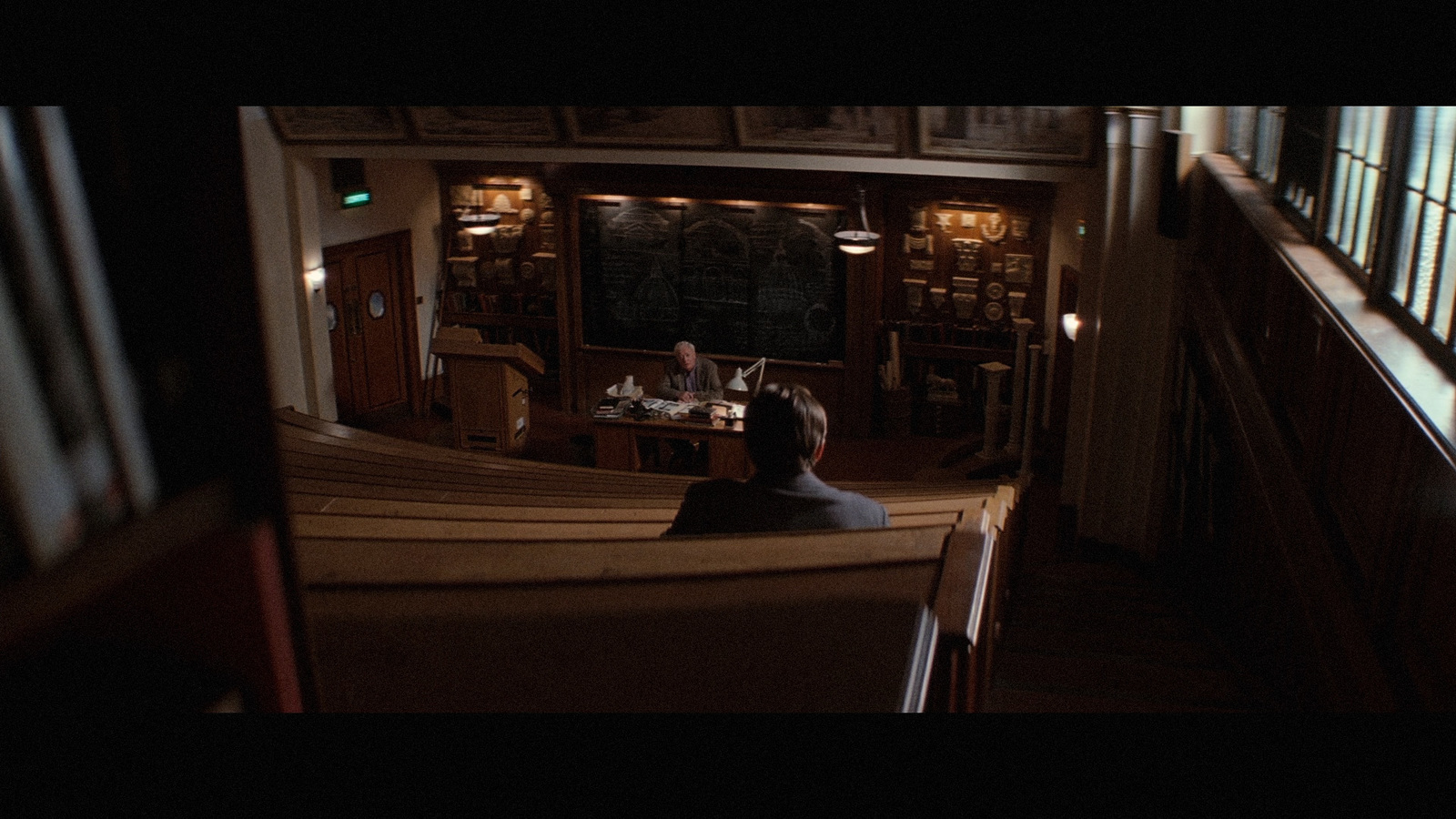 a man sitting at a table in a church