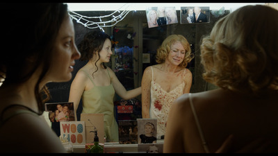 a woman looking at herself in the mirror