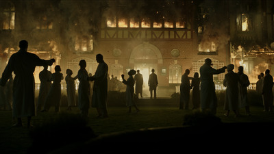 a group of people standing in front of a building