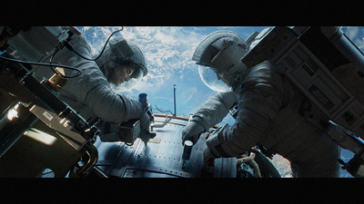 two men in space suits standing next to each other