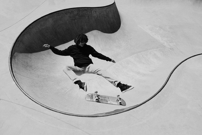 a man riding a skateboard up the side of a ramp