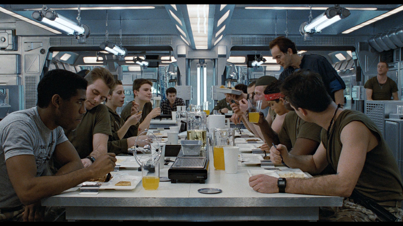 a group of people sitting around a table eating