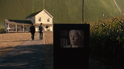 a picture of a woman walking down a sidewalk