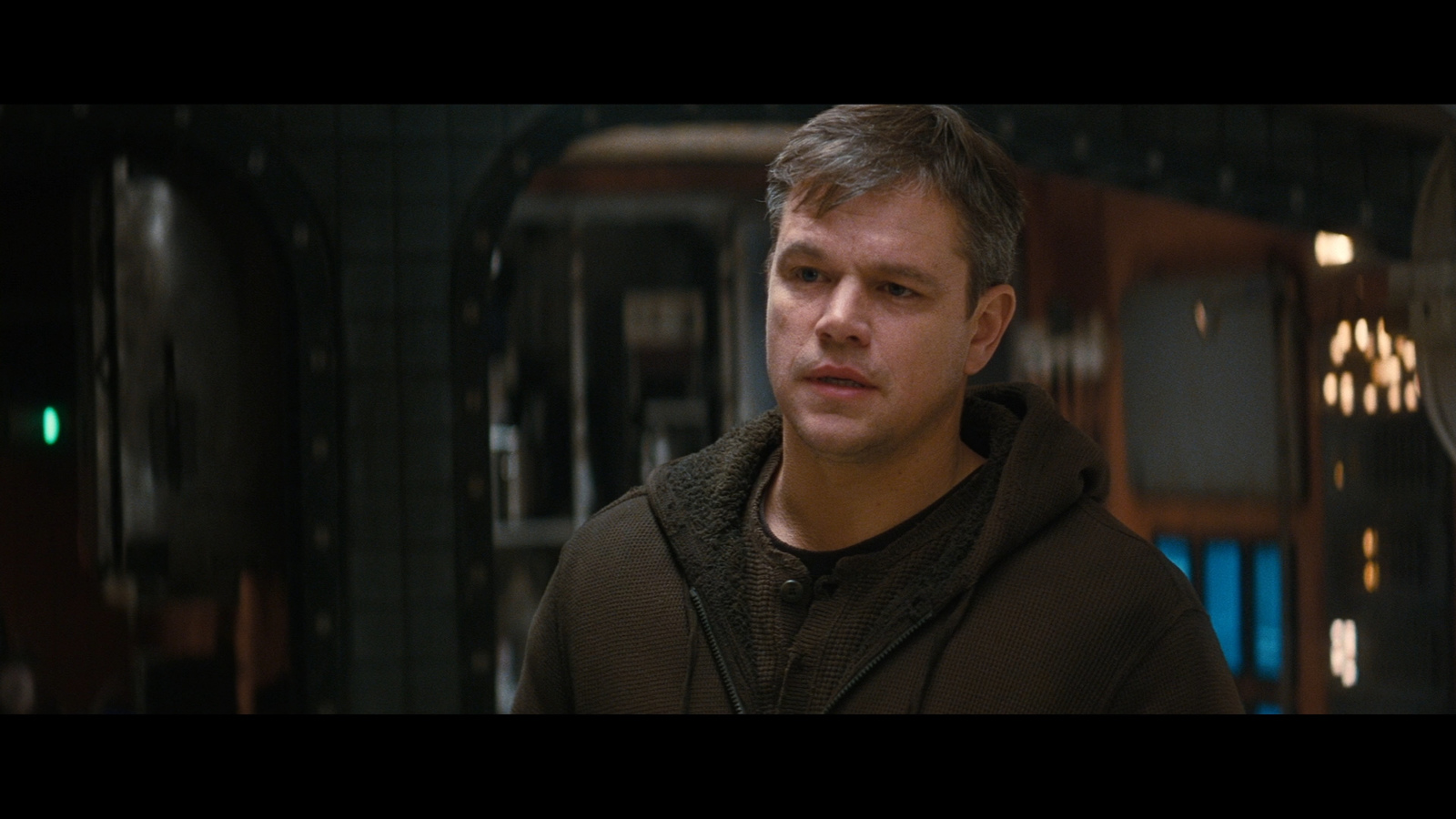 a man standing in front of a mirror in a room