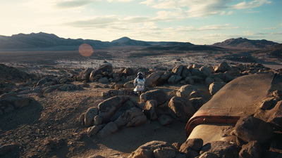 a person sitting on a pile of rocks