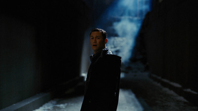 a man standing in a dark alley in the dark