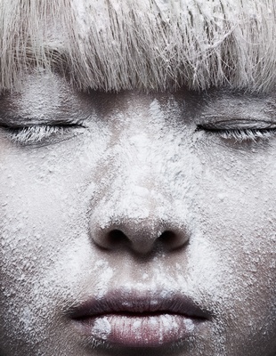 a close up of a person with snow on their face