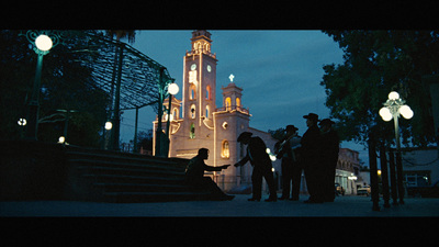 a group of people standing in front of a clock tower