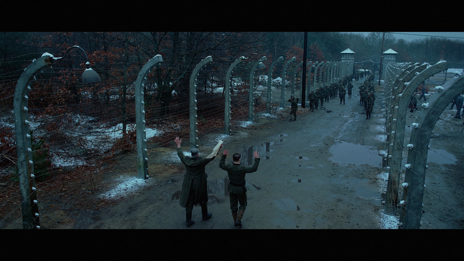 a couple of people that are standing in the snow