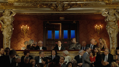 a group of people sitting at a table in a room