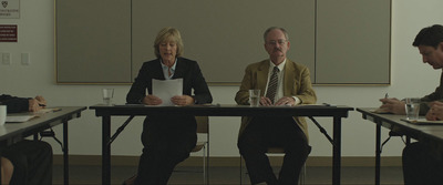 a group of people sitting around a table