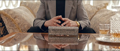 a man in a suit sitting at a table