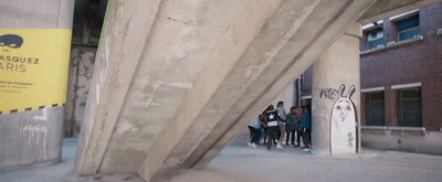 a group of people standing outside of a building