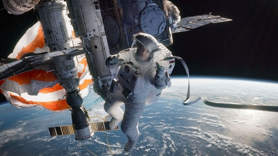 a man in a spacesuit floating above the earth