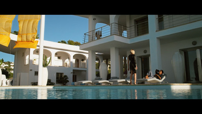 a couple of people that are standing in front of a house