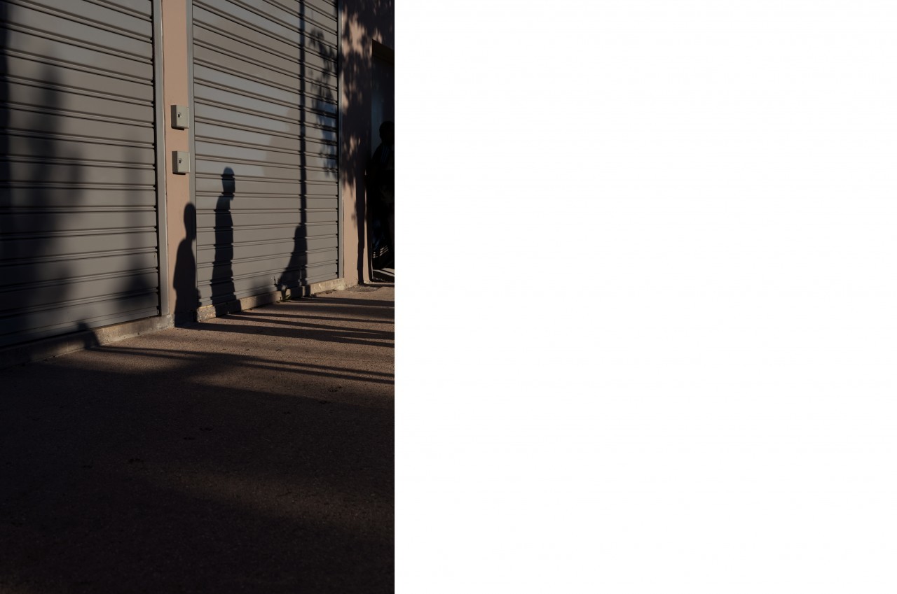 the shadow of a building on the side of a building