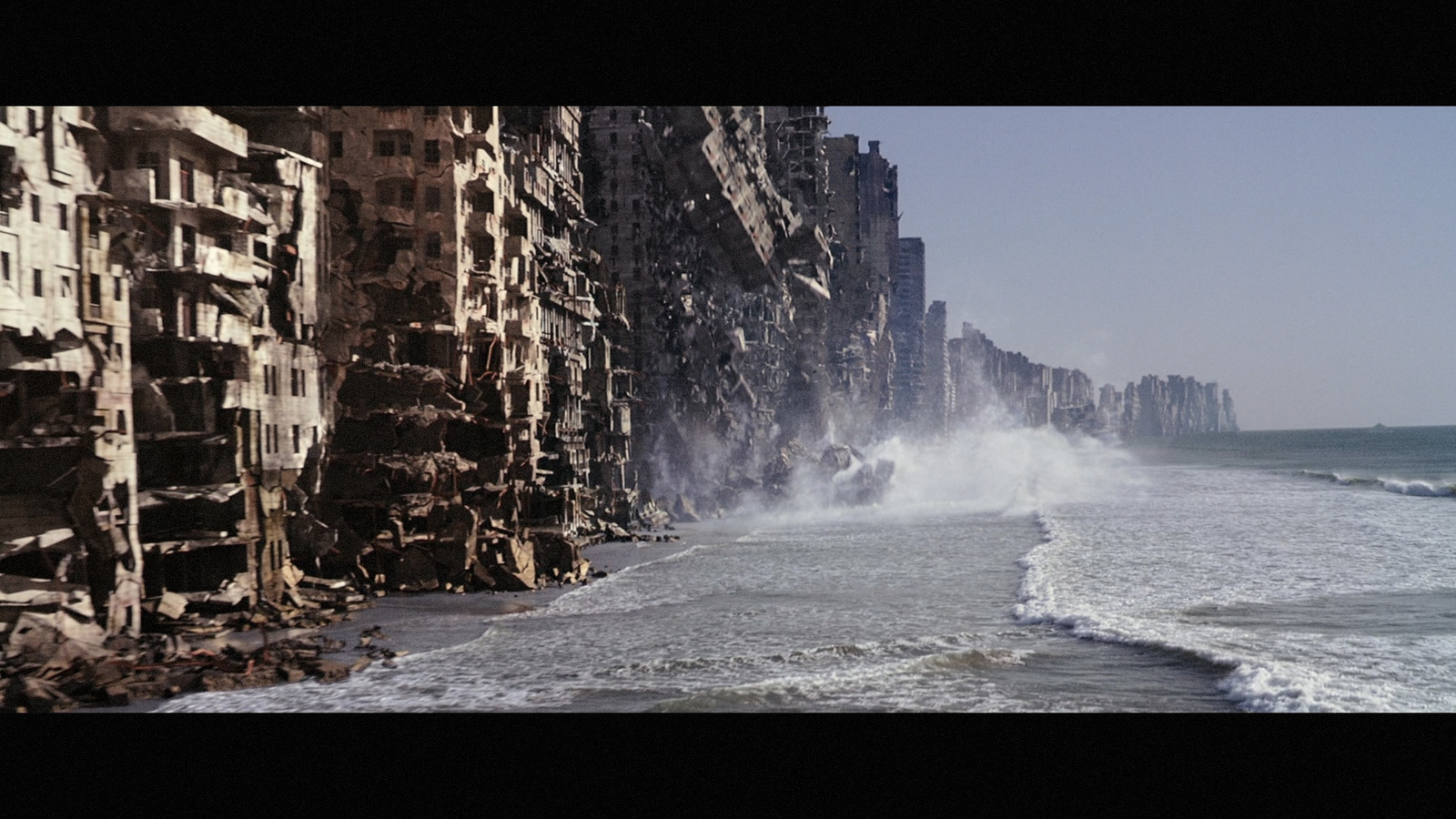 a large wave crashes into the shore of a beach