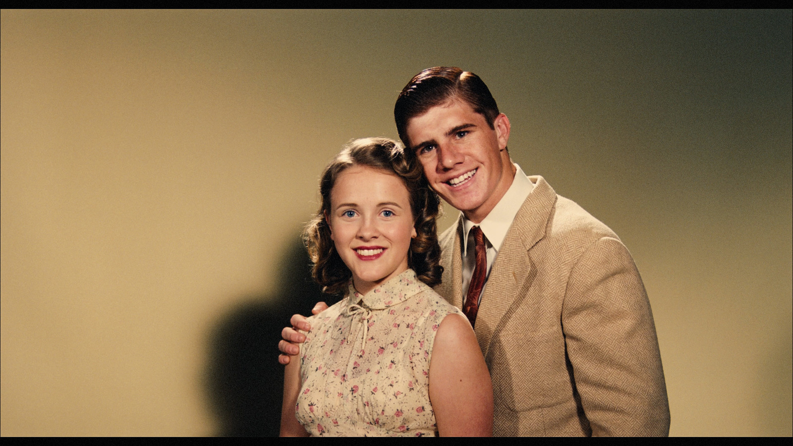 a man and a woman posing for a picture