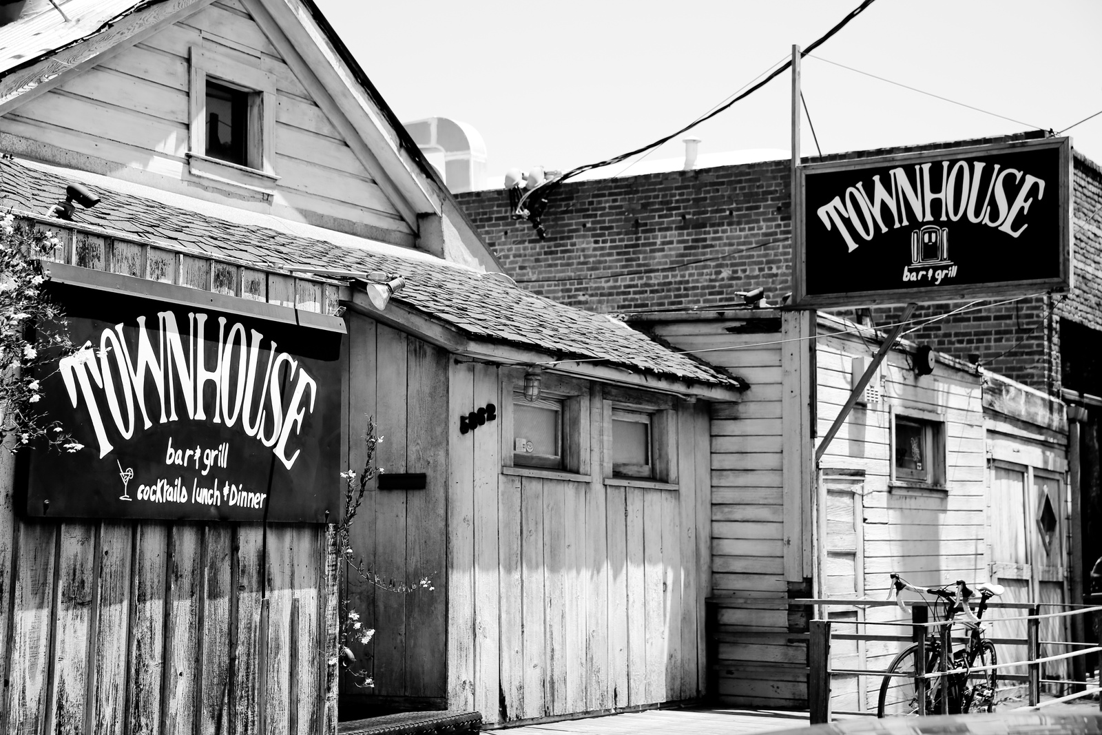 a black and white photo of a townhouse