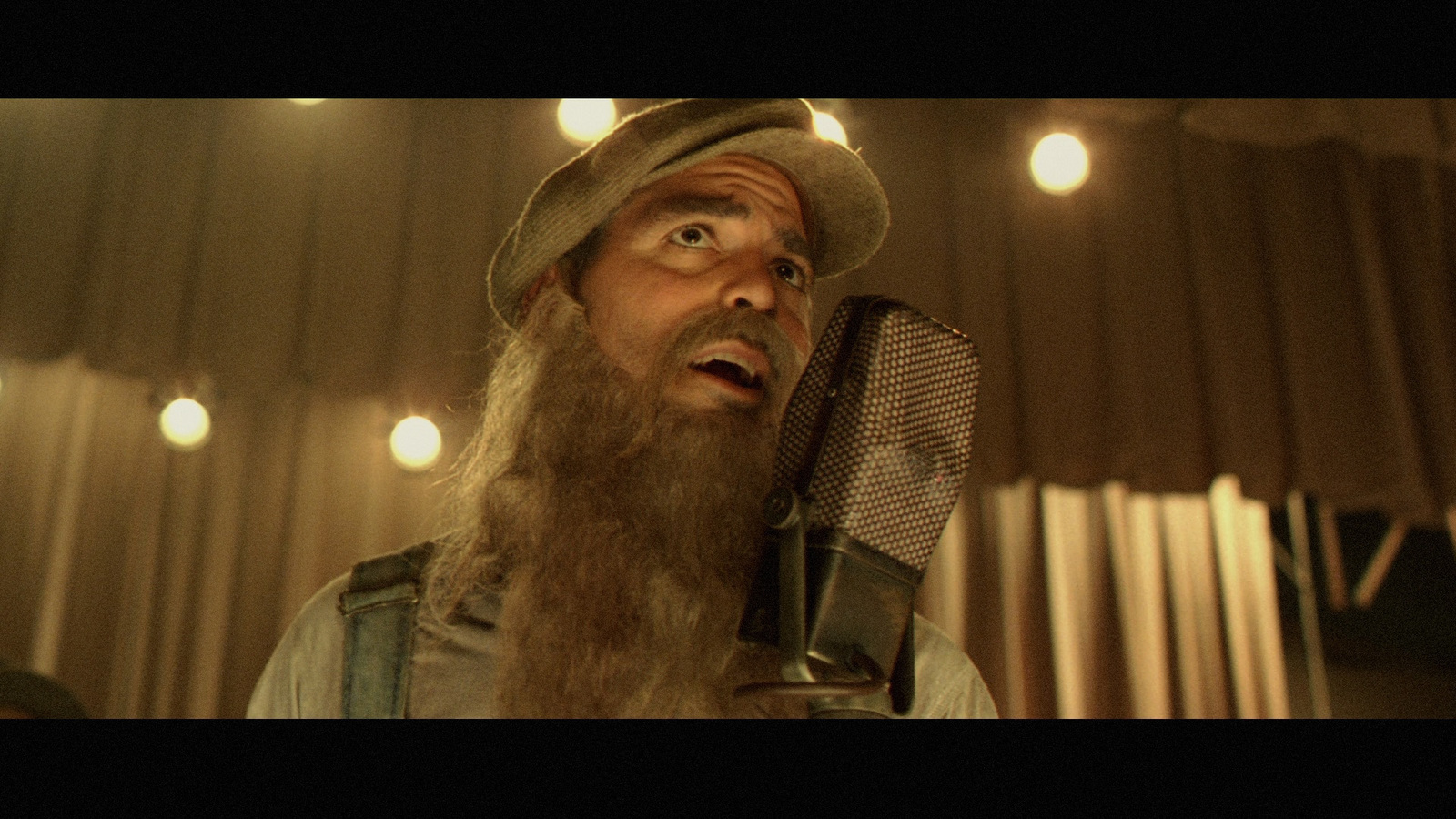 a man with a long beard wearing a hat