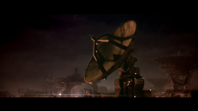 a satellite dish sitting on top of a wooden pole