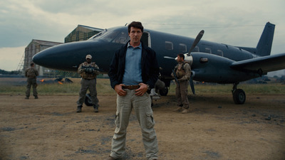 a man standing in front of an airplane