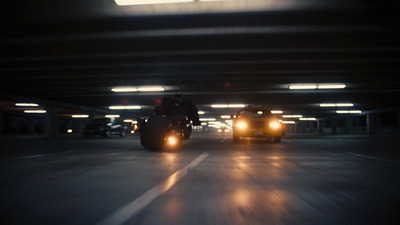 a couple of people riding on the back of a motorcycle