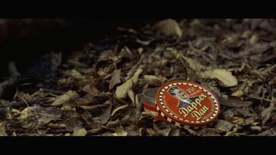 a close up of a tin of food on the ground