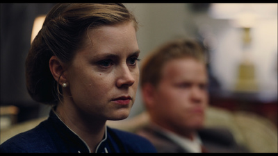 a man and a woman sitting next to each other