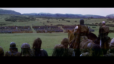 a group of people on horses in a field