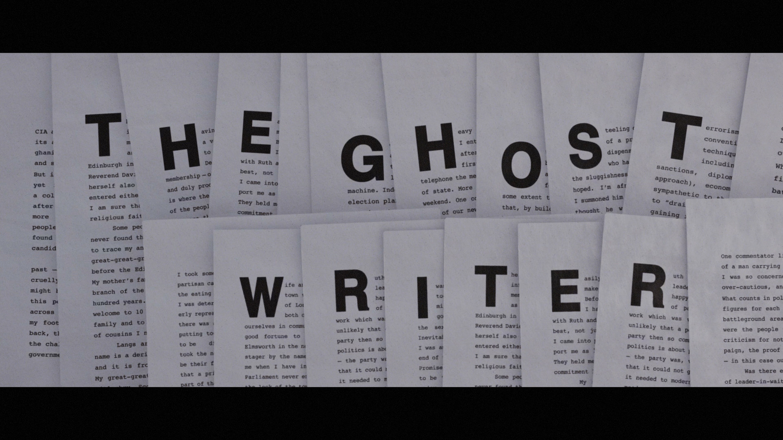 a pile of white papers with the words the ghost writer on them