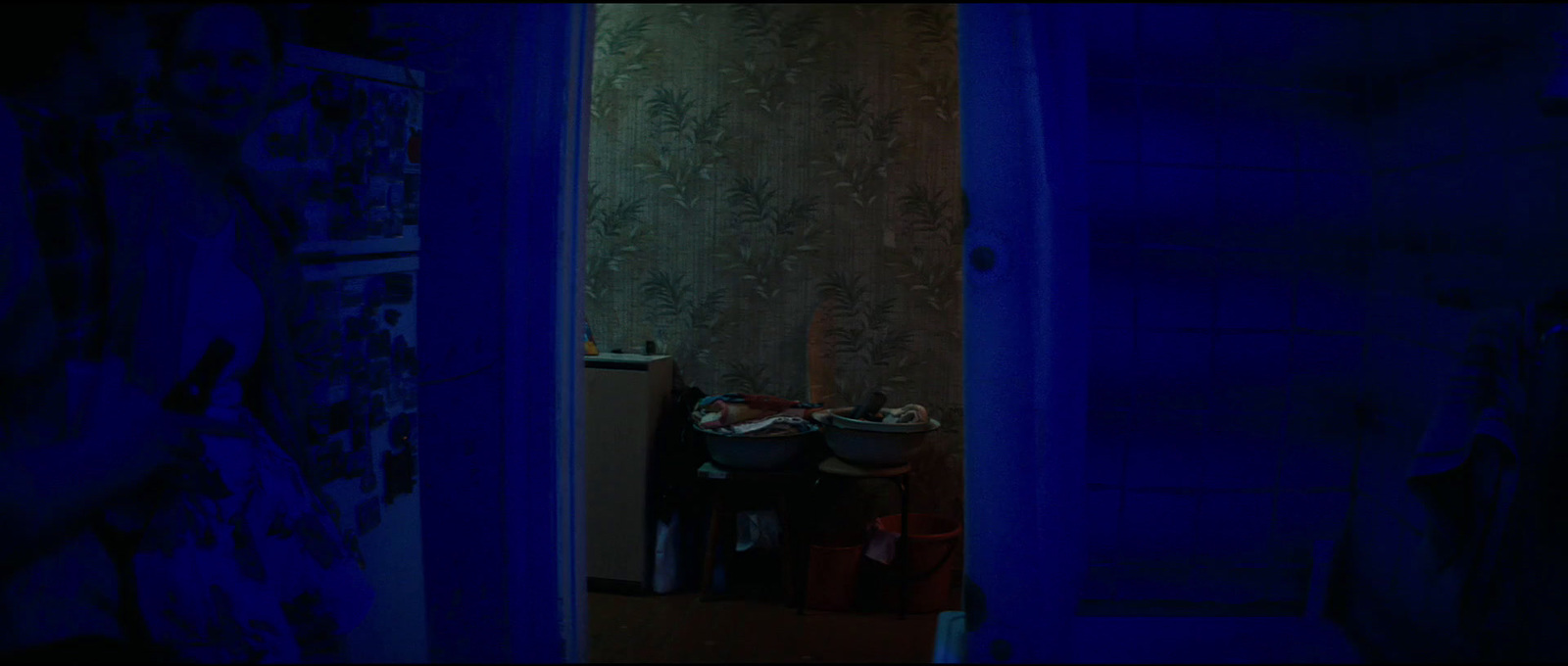 a room with a blue wall and a blue door