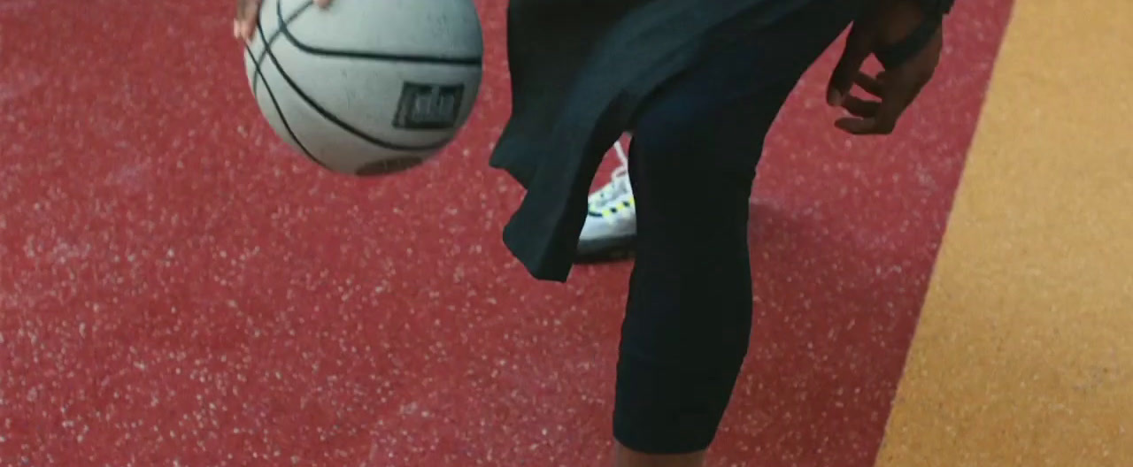 a close up of a person holding a basketball