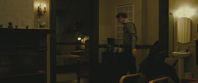 a man standing in a dimly lit room