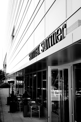 a black and white photo of a store front