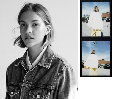 a black and white photo of a woman wearing a jean jacket