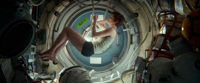 a woman is sitting in a space station