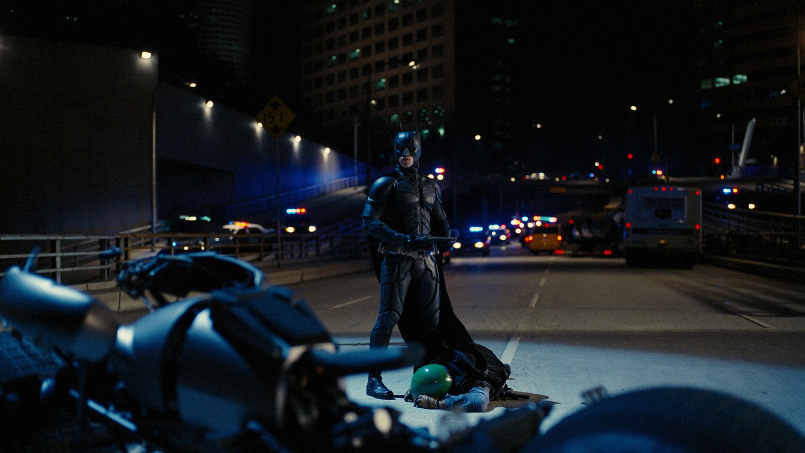 a man dressed as darth vader standing in a parking lot