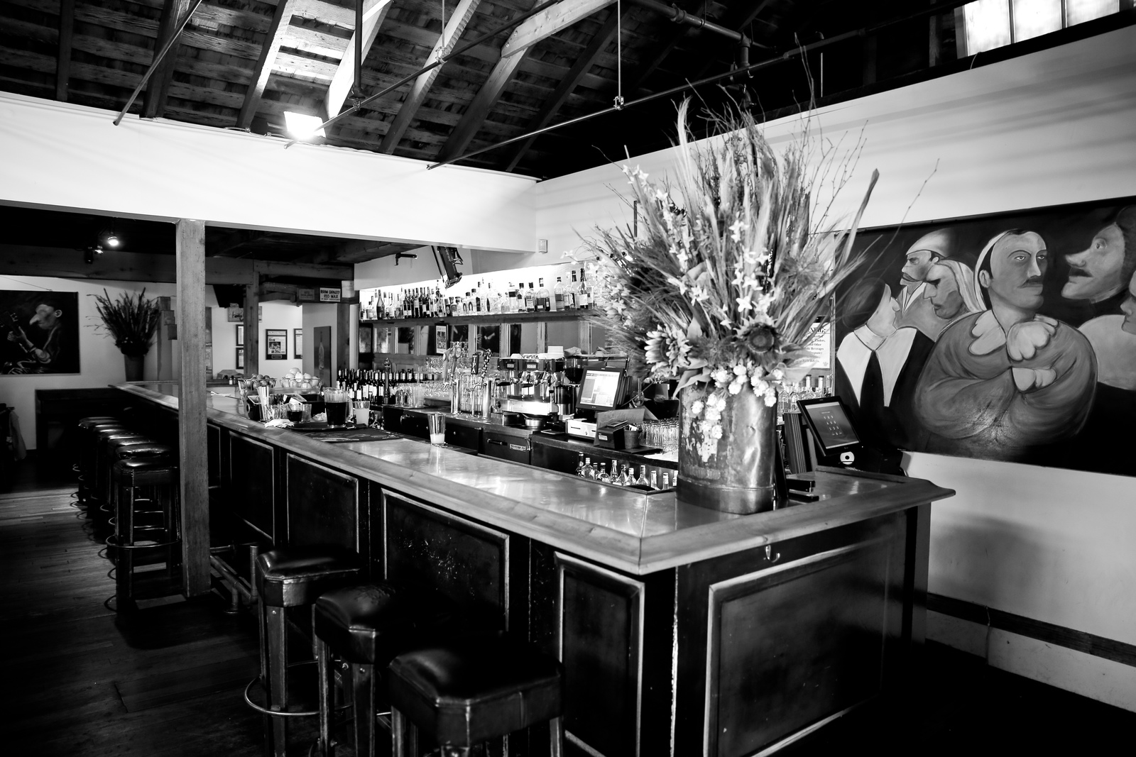 a black and white photo of a bar