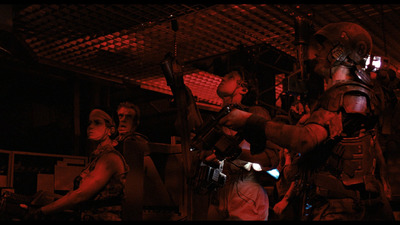 a group of people with guns in a dark room