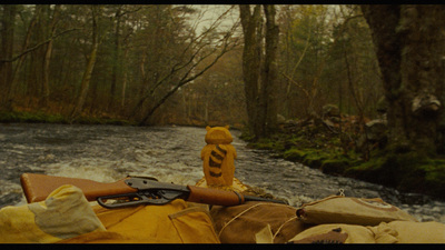 a gun is sitting on the back of a raft